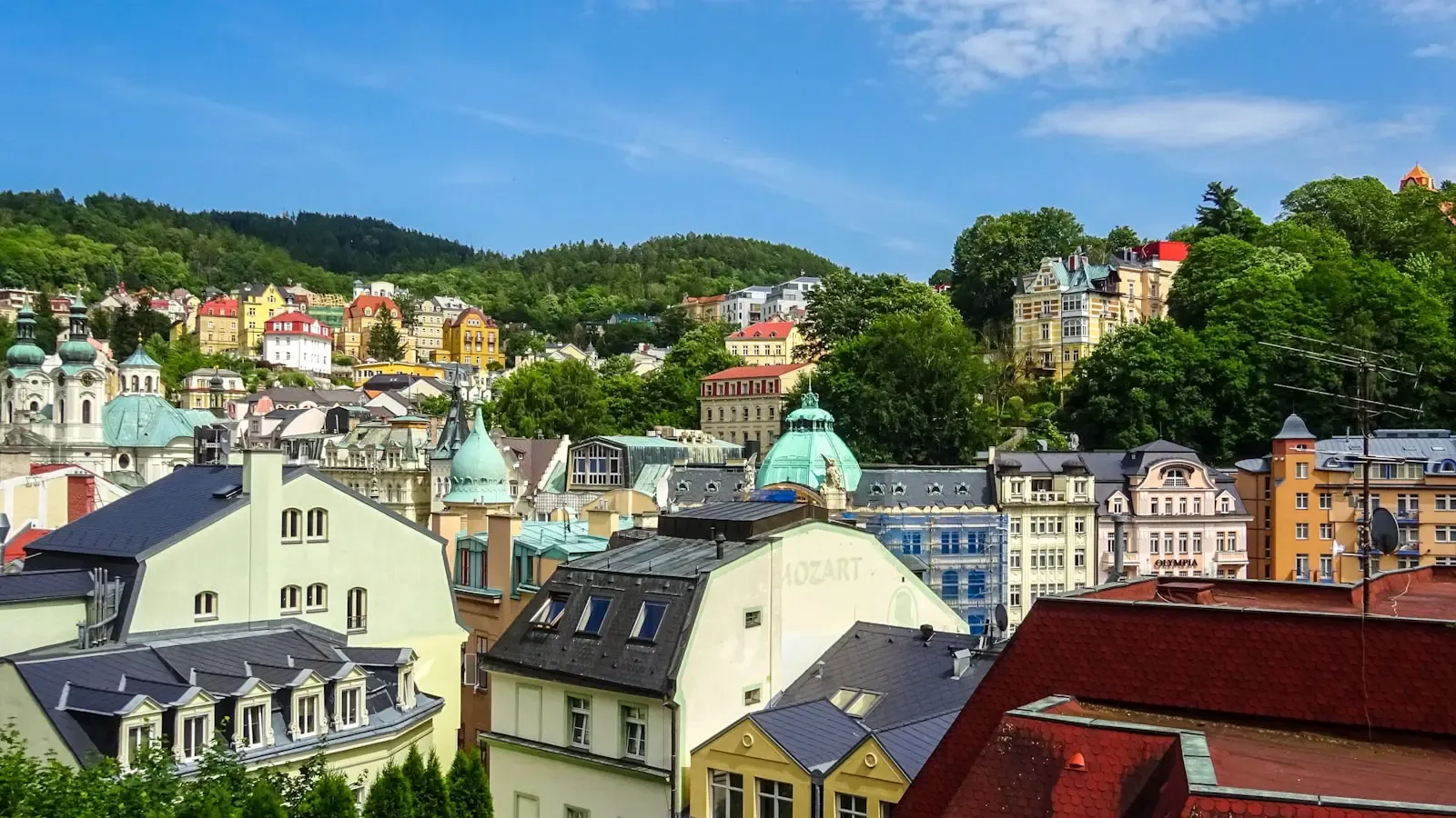 Why is Karlovy Vary a better choice for wellness travelers than a standard hotel spa