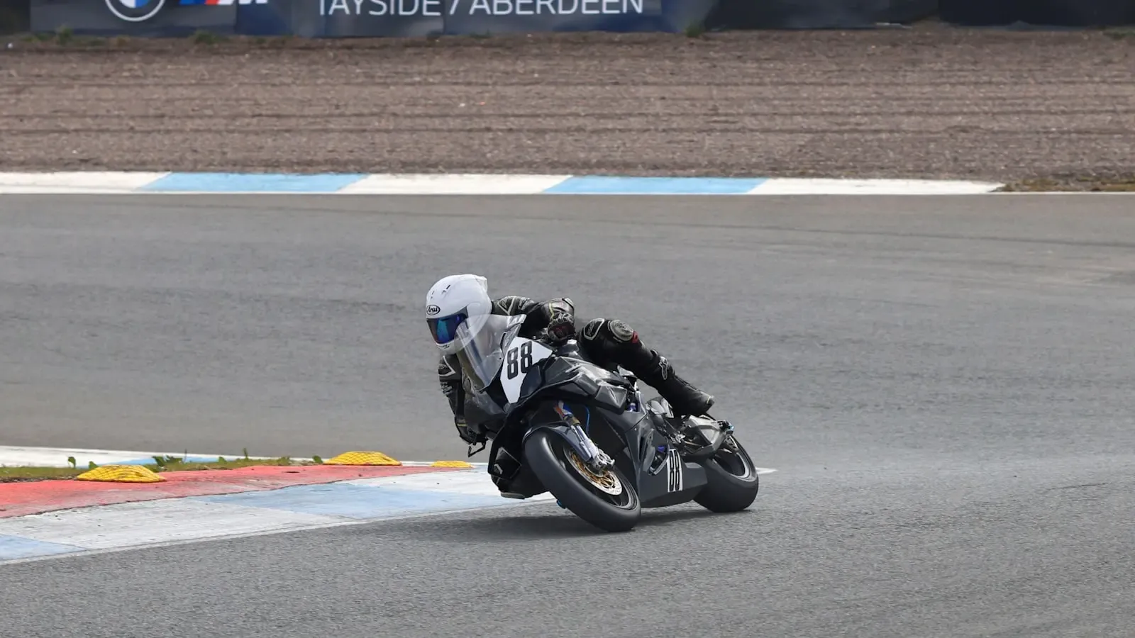 How do professional motorcycle racers sustain peak performance during a season