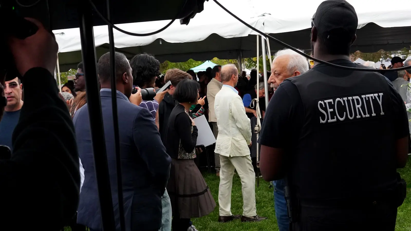 How can event organizers protect VIPs from hostile crowd reactions?